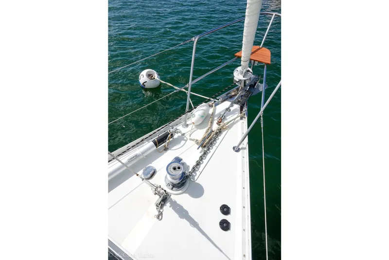 Slide: The Image of Bow of 1993 Alden 43 Aft Cockpit sailboat with anchor chain and winch. - 24