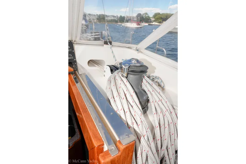 Slide: The Image of Alden 43 Aft Cockpit sailboat, 1993 model, featuring winch and ropes on deck. - 26