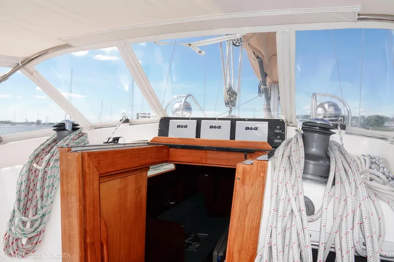 Slide: The Image of Cockpit view of 1993 Alden 43 Aft Cockpit yacht with navigation equipment and ropes. - 28