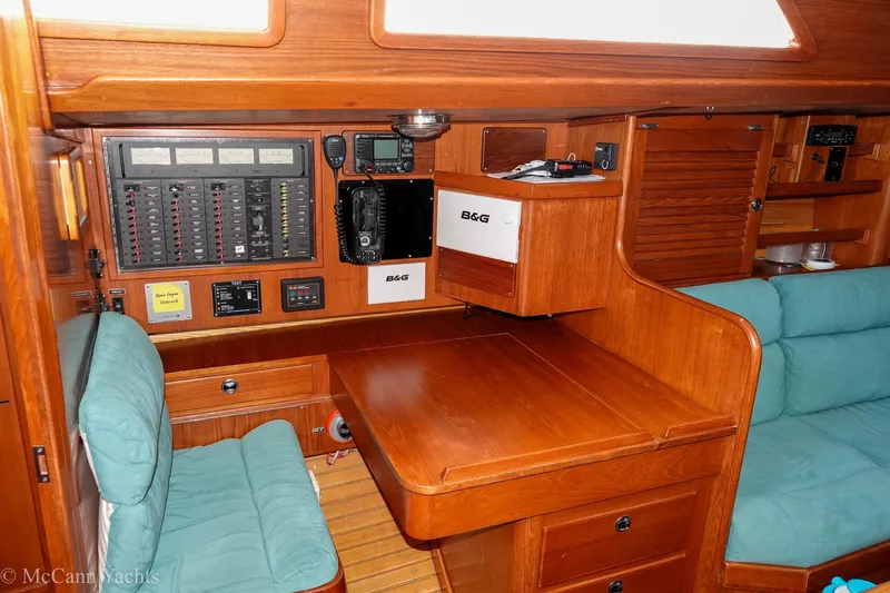 Slide: The Image of Interior of 1993 Alden 43 Aft Cockpit yacht with navigation equipment and wooden furnishings. - 34