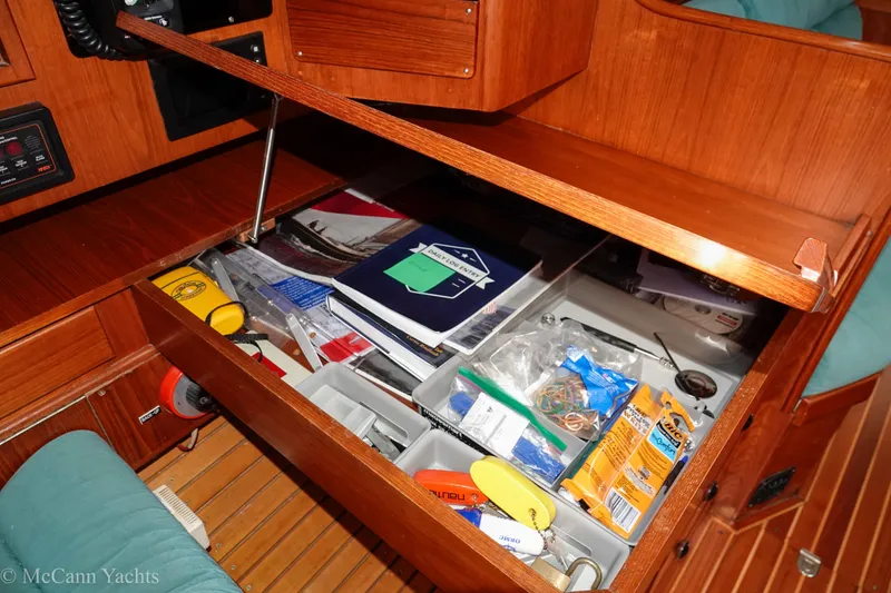 Slide: The Image of Open drawer in 1993 Alden 43 Aft Cockpit yacht, containing various tools and supplies. - 36