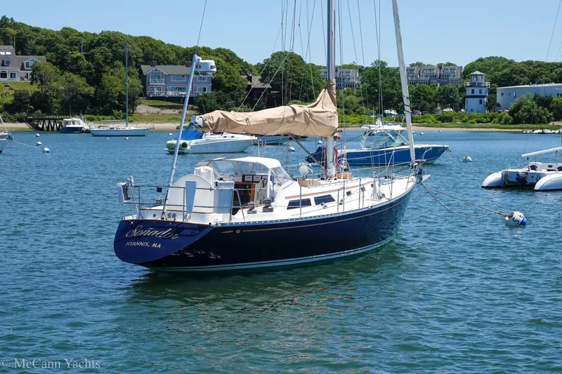 Slide: The Image of Sailboat Alden 43 Aft Cockpit, 1993 model, moored in a scenic harbor. - 4