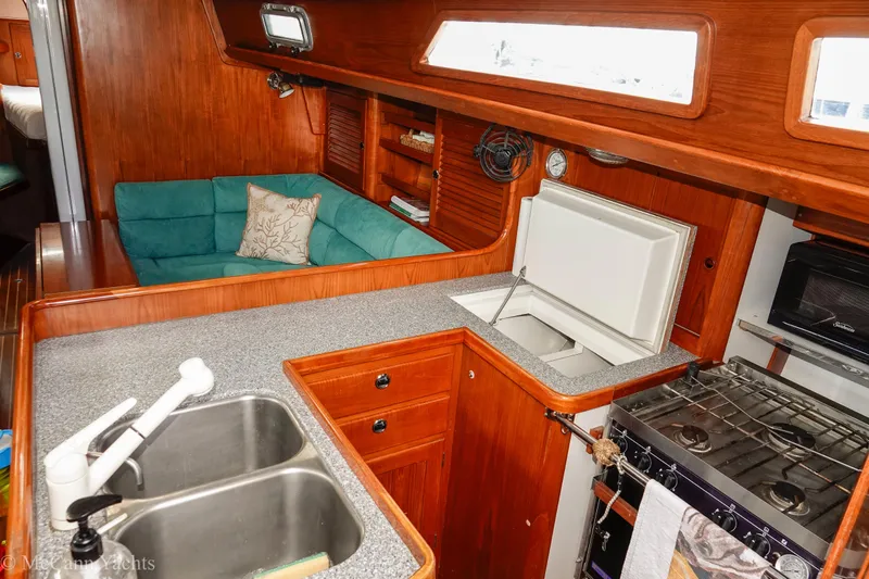 Slide: The Image of Interior of 1993 Alden 43 Aft Cockpit yacht with kitchen and seating area. - 40