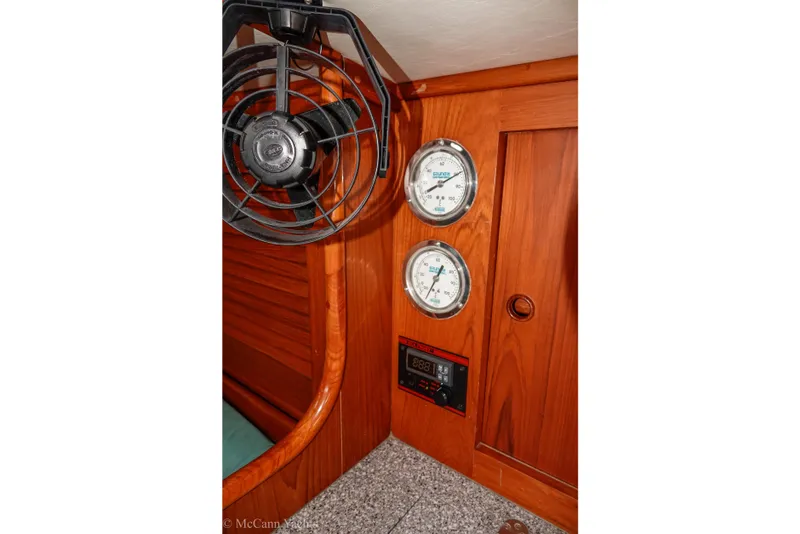 Slide: The Image of Interior of 1993 Alden 43 Aft Cockpit yacht with gauges and fan. - 42