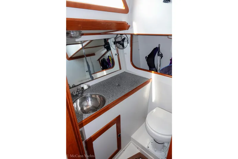 Slide: The Image of Bathroom interior of 1993 Alden 43 Aft Cockpit yacht with sink and toilet. - 49