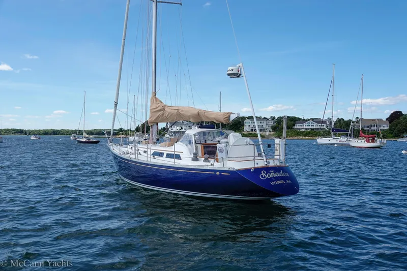 Slide: The Image of Alden 43 Aft Cockpit yacht, 1993 model, anchored in a scenic harbor. - 5