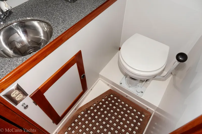 Slide: The Image of Alden 43 Aft Cockpit 1993 yacht bathroom with sink and marine toilet. - 50
