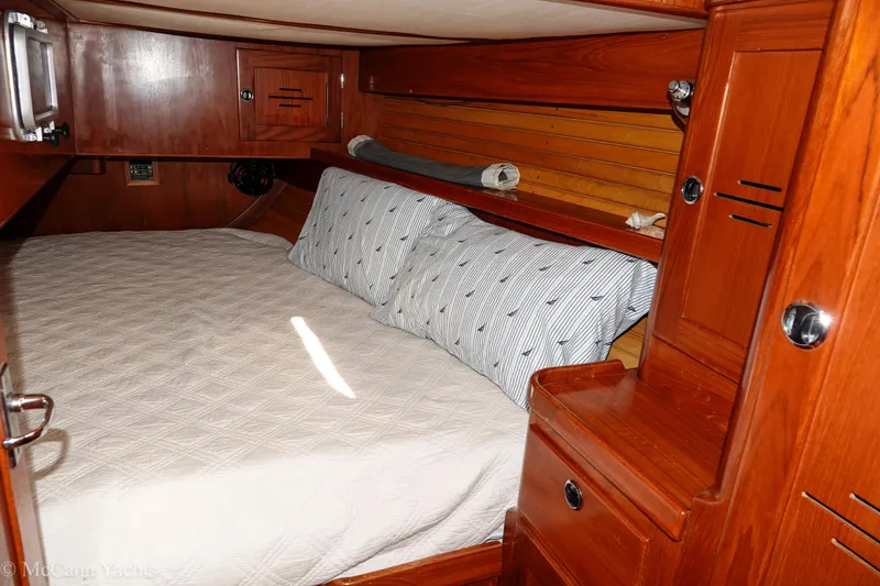 Slide: The Image of Cozy cabin interior of 1993 Alden 43 Aft Cockpit yacht with wooden furnishings. - 57