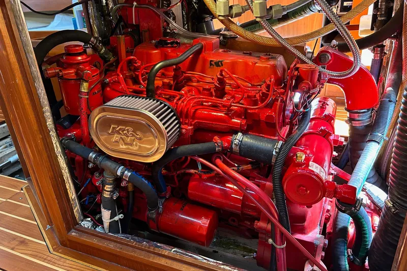 Slide: The Image of Engine of 1993 Alden 43 Aft Cockpit yacht, featuring vibrant red components. - 60