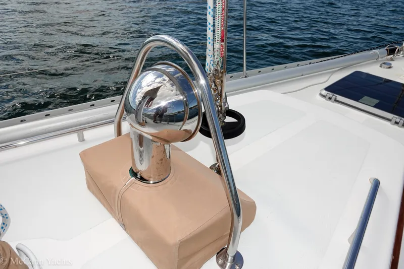 Slide: The Image of Alden 43 Aft Cockpit yacht deck detail, featuring polished metal and nautical equipment. - 63