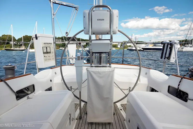 Slide: The Image of Alden 43 Aft Cockpit sailboat, 1993 model, with spacious deck and steering wheel. - 65