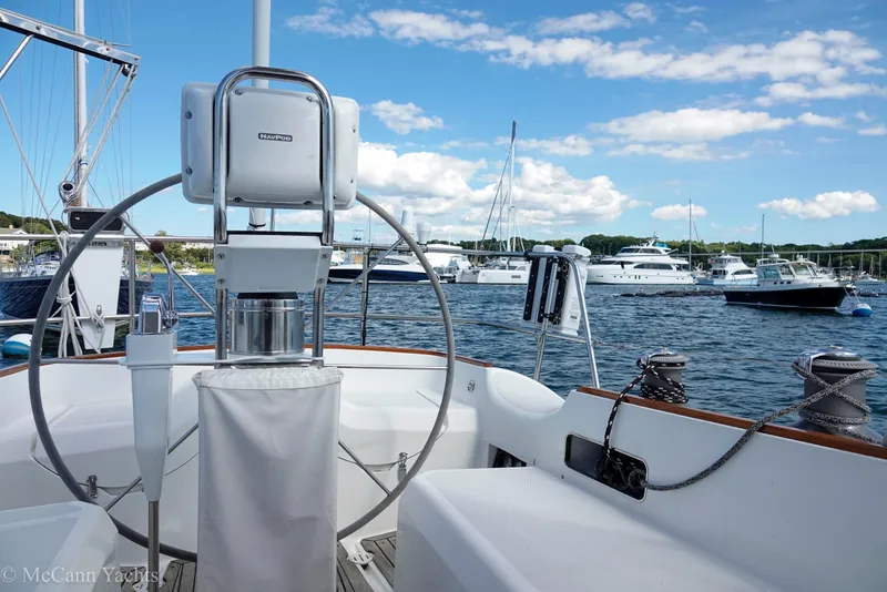 Slide: The Image of Cockpit view of 1993 Alden 43 Aft yacht, marina background, clear sky. - 67