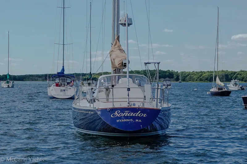 Slide: The Image of Sailboat Alden 43 Aft Cockpit, 1993, anchored in a scenic harbor. - 7
