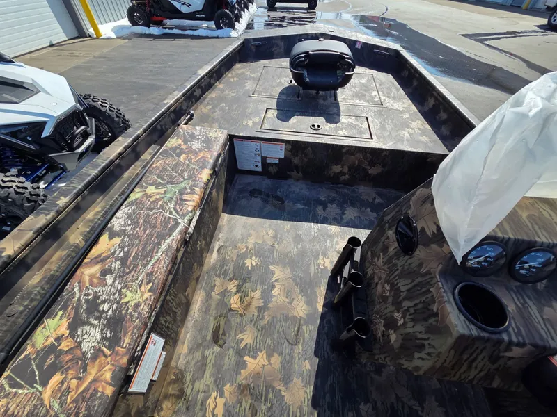 Slide: The Image of Interior of 2026 Crestliner 1860 Retriever SC with camouflage design. - 11