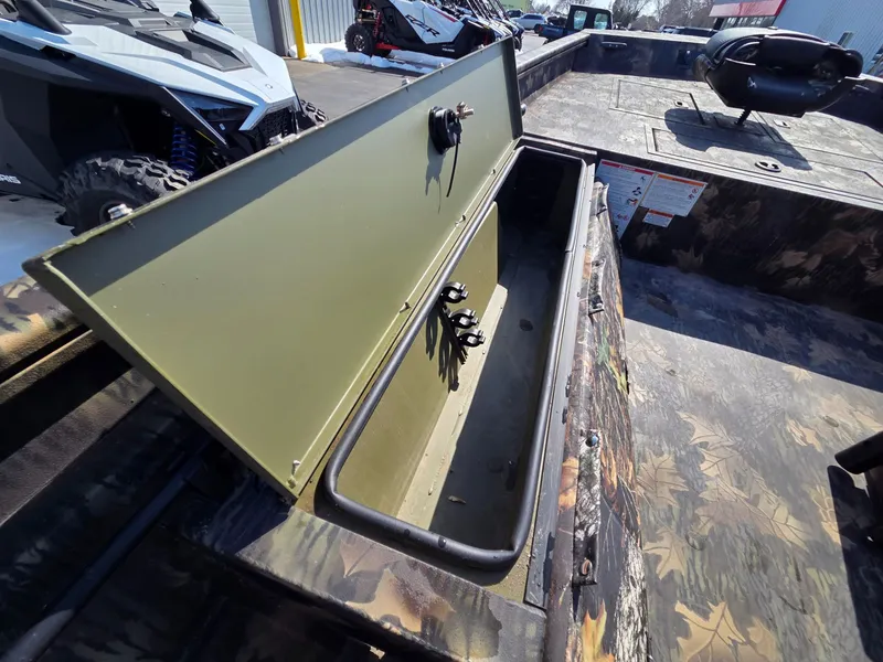 Slide: The Image of 2026 Crestliner 1860 Retriever SC with open storage compartment. - 12