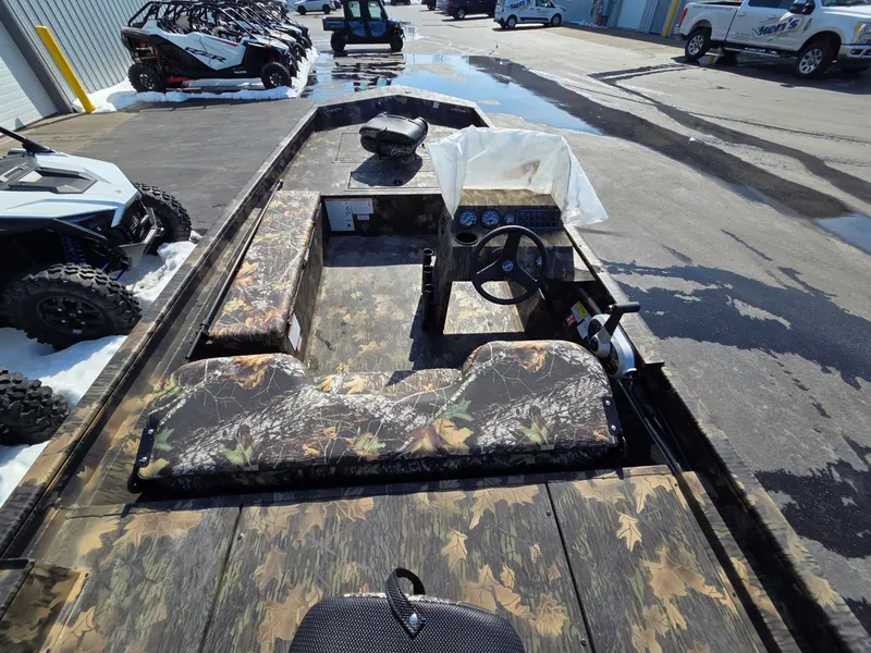 Slide: The Image of 2026 Crestliner 1860 Retriever SC with camouflage pattern outdoors. - 16