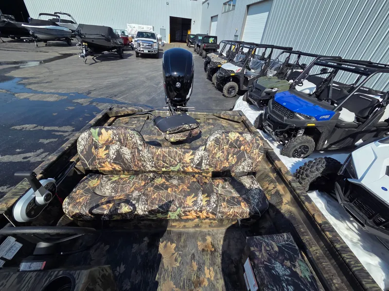 Slide: The Image of 2026 Crestliner 1860 Retriever SC with camouflage seats outdoors. - 8