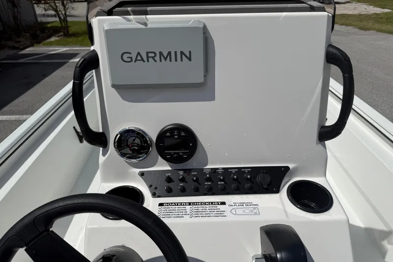 Slide: The Image of Console of 2026 Avid 20 Rogue CC boat with Garmin navigation system. - 10