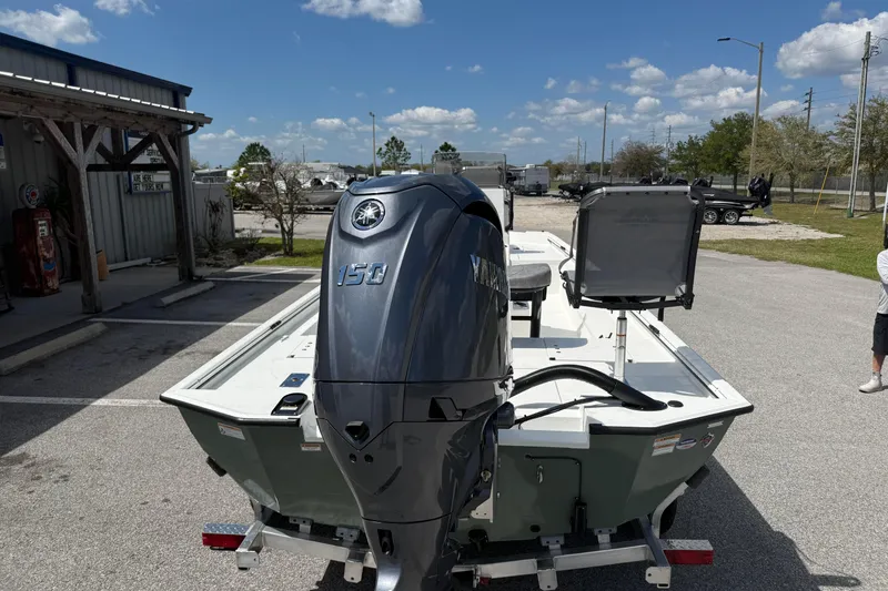 Slide: The Image of Avid 20 Rogue CC 2026 boat with Yamaha 150 engine in parking lot. - 4