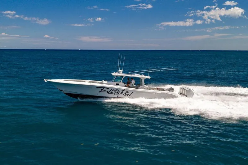 Slide: The Image of 2023 HCB 53 Suenos boat cruising on open ocean under clear blue sky. - 10