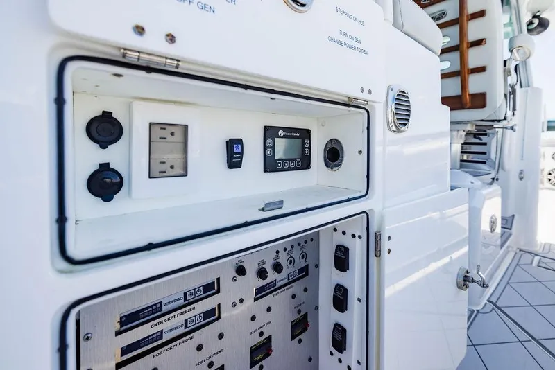 Slide: The Image of Control panel of 2023 HCB 53 Suenos boat, featuring electrical outlets and switches. - 102
