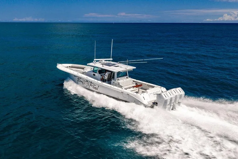 Slide: The Image of 2023 HCB 53 Suenos boat cruising on open ocean waters. - 11