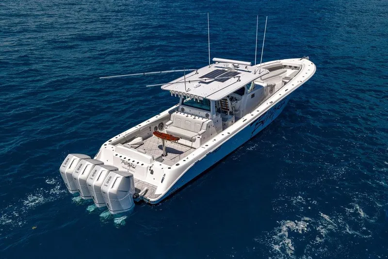 Slide: The Image of 2023 HCB 53 Suenos boat cruising on open blue ocean waters. - 16