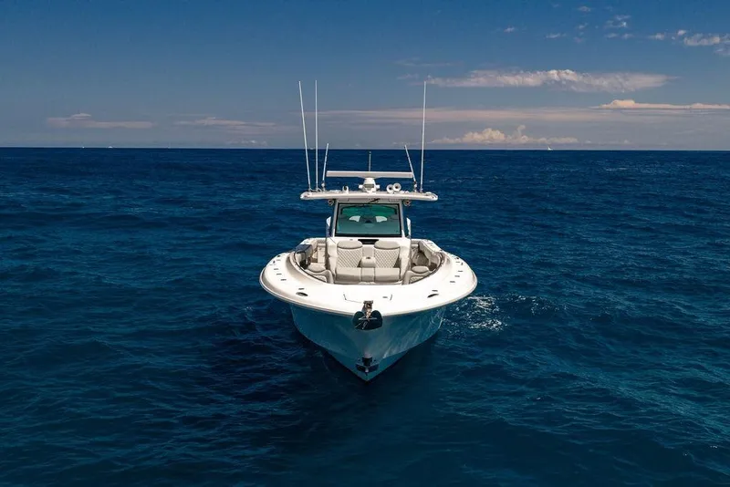 Slide: The Image of 2023 HCB 53 Suenos boat cruising on open ocean under clear blue sky. - 18