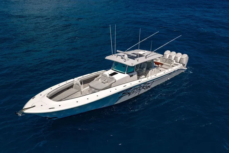 Slide: The Image of 2023 HCB 53 Suenos boat cruising on open blue ocean waters. - 19