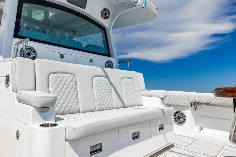Slide: The Image of Luxurious seating on the 2023 HCB 53 Suenos boat, featuring elegant white upholstery. - 39