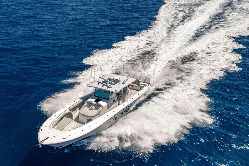 Slide: The Image of 2023 HCB 53 Suenos boat cruising on open blue ocean waters. - 4