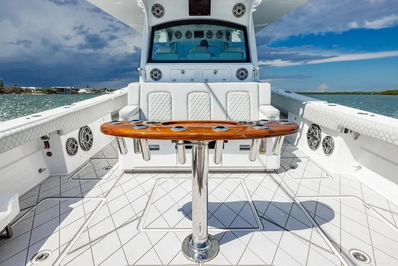 Slide: The Image of 2023 HCB 53 Suenos luxury boat interior with sleek seating and polished wood table. - 40