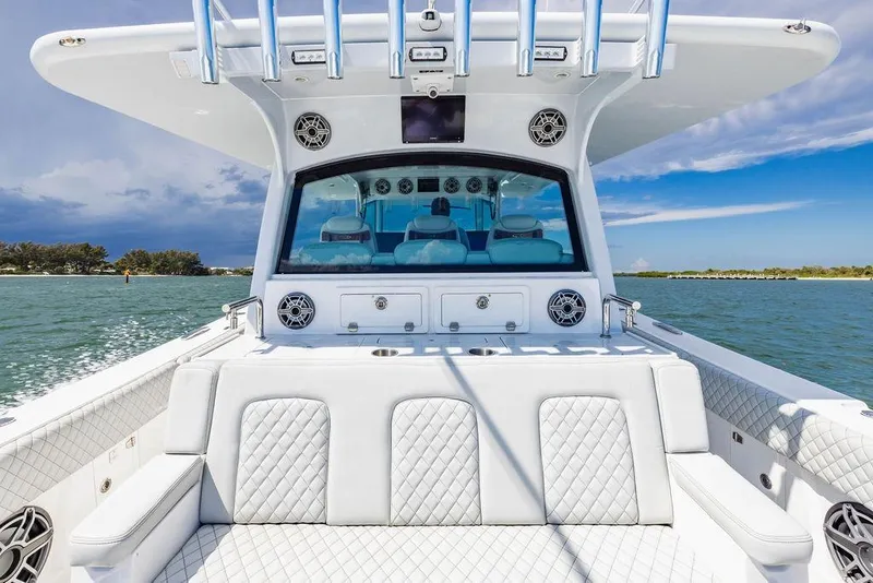 Slide: The Image of 2023 HCB 53 Suenos luxury boat interior with plush seating and ocean view. - 42