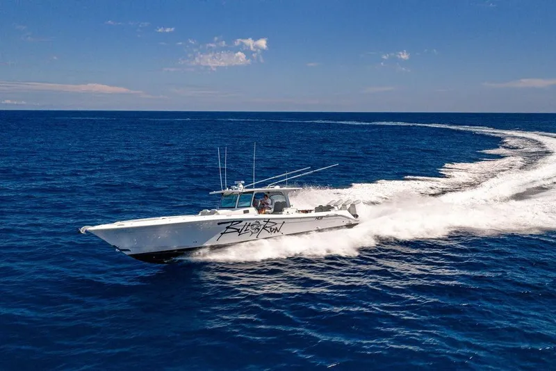 Slide: The Image of 2023 HCB 53 Suenos boat cruising on open ocean under clear blue sky. - 5