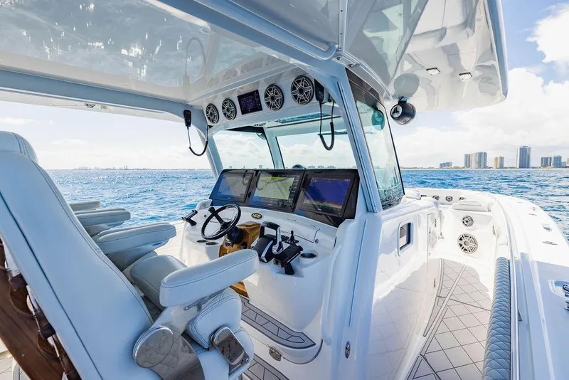 Slide: The Image of Luxurious 2023 HCB 53 Suenos boat interior with advanced navigation system on open sea. - 54