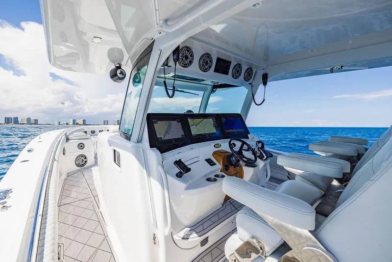 Slide: The Image of 2023 HCB 53 Suenos boat interior with advanced navigation system and luxurious seating. - 55
