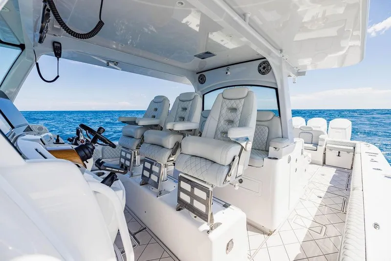 Slide: The Image of Luxurious interior of 2023 HCB 53 Suenos boat with plush seating and ocean view. - 56