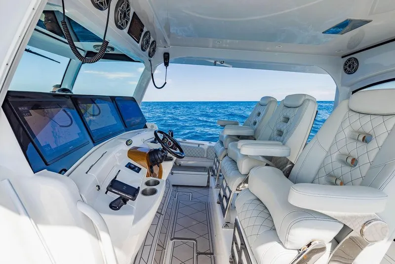 Slide: The Image of Luxurious interior of 2023 HCB 53 Suenos boat with plush seating and advanced navigation displays. - 57