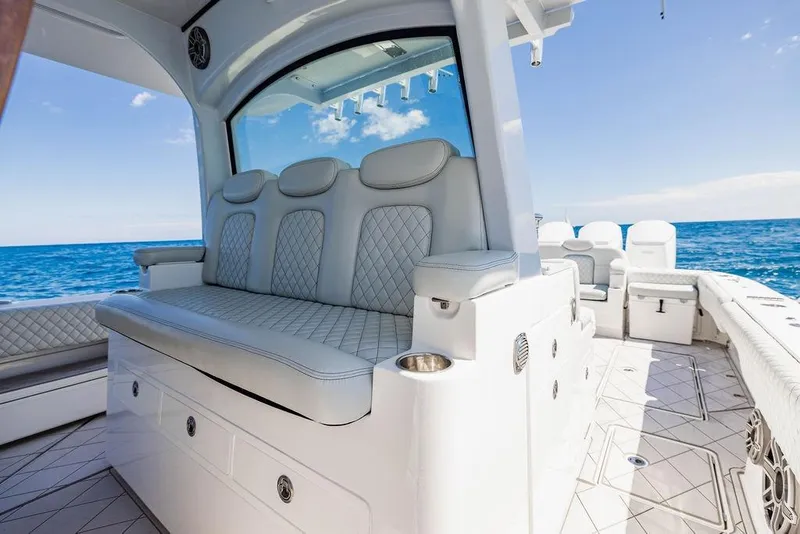 Slide: The Image of 2023 HCB 53 Suenos luxury boat interior with plush seating, ocean view. - 59