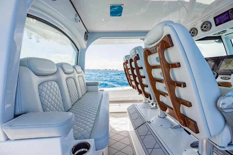 Slide: The Image of Luxurious interior of 2023 HCB 53 Suenos boat with plush seating and ocean view. - 60