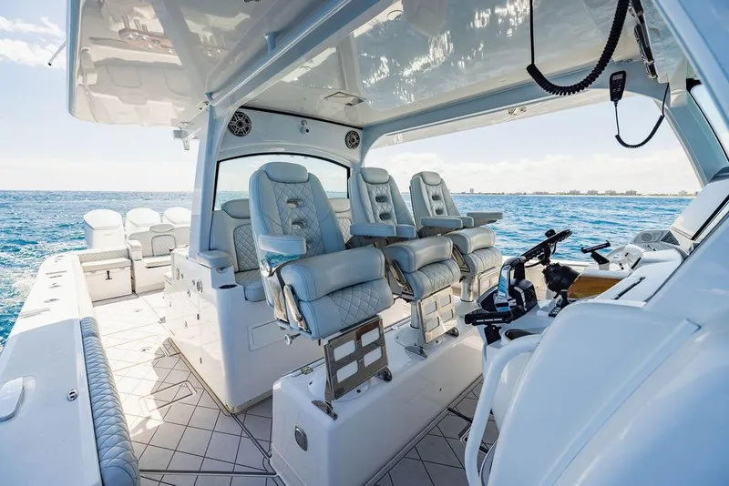 Slide: The Image of Luxurious 2023 HCB 53 Suenos boat interior with plush seating and ocean view. - 61