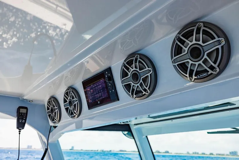 Slide: The Image of 2023 HCB 53 Suenos boat interior with JL Audio speakers and control panel. - 63