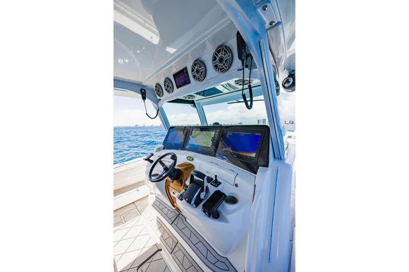 Slide: The Image of Cockpit of 2023 HCB 53 Suenos boat with advanced navigation displays. - 65