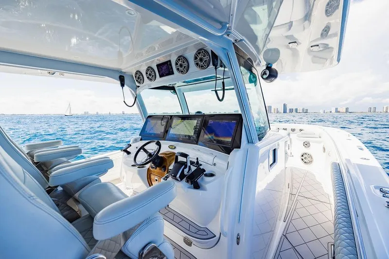 Slide: The Image of Luxurious 2023 HCB 53 Suenos boat interior with advanced navigation system on open water. - 66