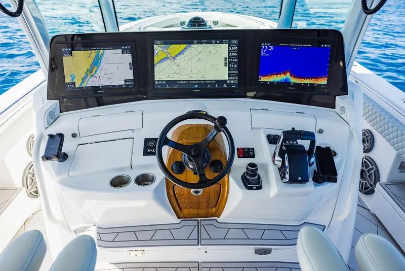 Slide: The Image of Helm of 2023 HCB 53 Suenos boat with advanced navigation displays. - 69