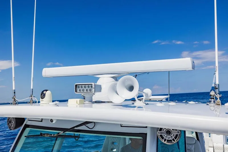 Slide: The Image of 2023 HCB 53 Suenos boat with radar and communication equipment against blue sky. - 71