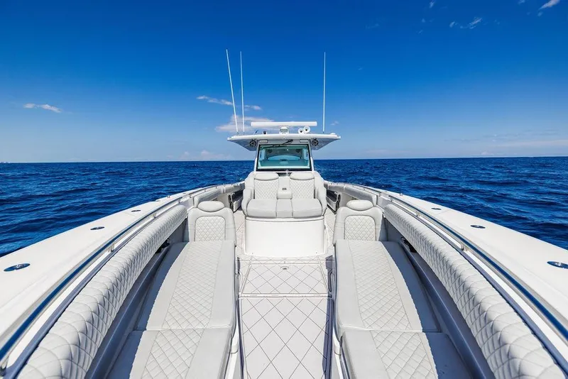 Slide: The Image of 2023 HCB 53 Suenos luxury boat on open ocean, clear blue sky. - 72