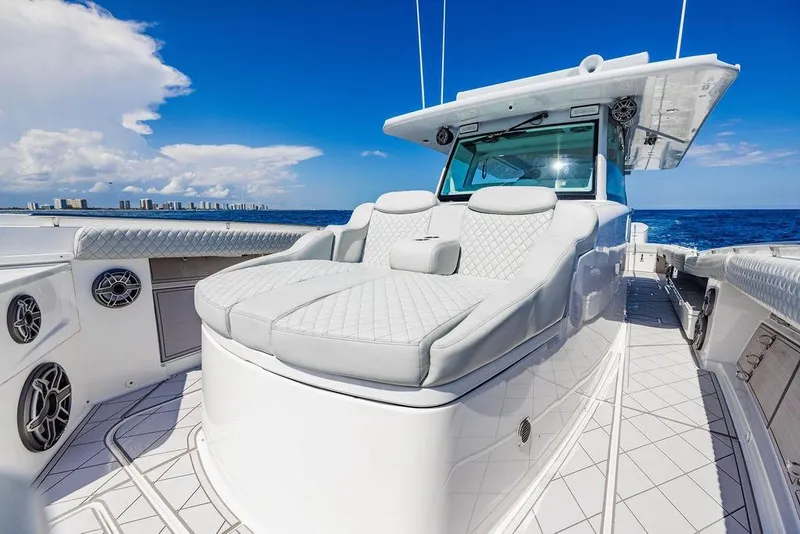 Slide: The Image of Luxurious 2023 HCB 53 Suenos yacht with plush seating, cruising on open ocean. - 73
