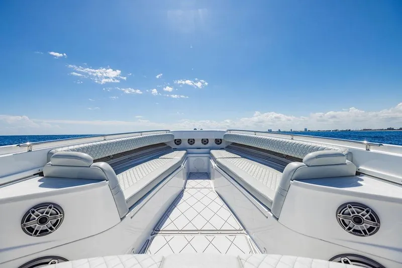 Slide: The Image of Luxurious seating on the 2023 HCB 53 Suenos yacht under a clear blue sky. - 76
