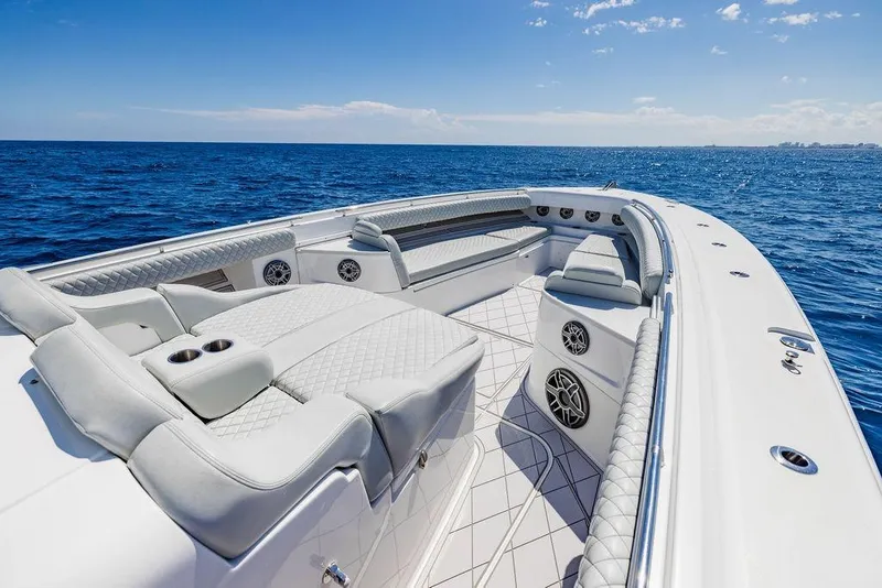 Slide: The Image of Luxurious 2023 HCB 53 Suenos boat interior with plush seating on open ocean. - 80